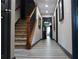 Hallway with wood-look flooring, stairway and fresh paint at 7825 Crownpoint Dr, Alpharetta, GA 30005