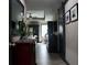 Hallway with modern floors, gray paint, dark cabinets, and decorative decor at 7825 Crownpoint Dr, Alpharetta, GA 30005
