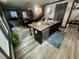 Open kitchen layout with a central island, stainless steel appliances, and hardwood flooring at 7825 Crownpoint Dr, Alpharetta, GA 30005