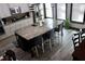 This kitchen features a granite island with seating and stainless steel appliances at 7825 Crownpoint Dr, Alpharetta, GA 30005