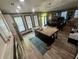 Open concept kitchen with island, stainless steel appliances, and hardwood floors at 7825 Crownpoint Dr, Alpharetta, GA 30005