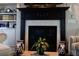A beautifully crafted fireplace and built-in bookshelves add charm to the living room at 7825 Crownpoint Dr, Alpharetta, GA 30005