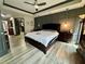 Luxurious main bedroom suite features a ceiling fan and modern decor at 7825 Crownpoint Dr, Alpharetta, GA 30005