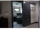 Home office with modern barn door and workstation, providing a functional workspace at 7825 Crownpoint Dr, Alpharetta, GA 30005