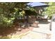 Backyard patio features outdoor seating and a stylish umbrella at 7825 Crownpoint Dr, Alpharetta, GA 30005