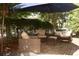 Secluded patio with shaded seating area, perfect for relaxing and entertaining outdoors at 7825 Crownpoint Dr, Alpharetta, GA 30005
