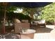 Inviting patio area with cozy wicker furniture, perfect for outdoor relaxation and entertainment at 7825 Crownpoint Dr, Alpharetta, GA 30005