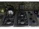 Modern stove top with stainless steel appliances at 7825 Crownpoint Dr, Alpharetta, GA 30005