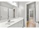 Bright bathroom with tile floor and a large mirror above the white vanity at 1999 Barrett Knoll Nw Cir, Kennesaw, GA 30152
