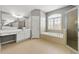 Bathroom features a large, jetted tub, vanity, and glass enclosed shower at 1999 Barrett Knoll Nw Cir, Kennesaw, GA 30152