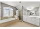Spacious bathroom with jetted tub, tiled floor, and double vanity at 1999 Barrett Knoll Nw Cir, Kennesaw, GA 30152