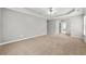 Spacious bedroom has neutral carpeting, and an archway leading to a bathroom at 1999 Barrett Knoll Nw Cir, Kennesaw, GA 30152