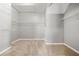 Walk-in closet featuring neutral carpeting and metal shelving on all sides at 1999 Barrett Knoll Nw Cir, Kennesaw, GA 30152
