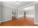 Elegant dining room with hardwood floors, wainscoting, and a chandelier at 1999 Barrett Knoll Nw Cir, Kennesaw, GA 30152