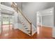 Bright foyer with hardwood floors and staircase leading to the second floor at 1999 Barrett Knoll Nw Cir, Kennesaw, GA 30152