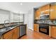 Cozy kitchen featuring granite countertops, stainless appliances, and eating area at 1999 Barrett Knoll Nw Cir, Kennesaw, GA 30152