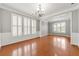 Bright living room with hardwood floors and large windows with wooden shutters at 1999 Barrett Knoll Nw Cir, Kennesaw, GA 30152