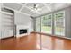 Cozy living room featuring a fireplace, built-in shelving, and large windows at 1999 Barrett Knoll Nw Cir, Kennesaw, GA 30152
