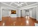 Open concept living room with hardwood floors and seamless flow to the kitchen at 1999 Barrett Knoll Nw Cir, Kennesaw, GA 30152