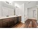 Spacious bathroom featuring a double vanity, hardwood floors, and a separate tub and shower at 3865 Rifflepool Ct, Douglasville, GA 30135