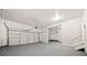 Spacious two-car garage with painted floor and ample storage space at 3865 Rifflepool Ct, Douglasville, GA 30135