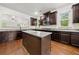 Stylish kitchen with granite countertops, wood floors, and stainless steel microwave at 3865 Rifflepool Ct, Douglasville, GA 30135