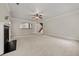 Expansive living room area with a fireplace, breakfast bar with access to the kitchen, and a view of the staircase at 3865 Rifflepool Ct, Douglasville, GA 30135
