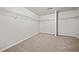 Expansive walk-in closet with carpeted floors and metal shelving for organized storage at 3865 Rifflepool Ct, Douglasville, GA 30135
