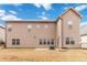 Spacious backyard is showcased from the exterior of this two-story home at 4808 Albany Way, Atlanta, GA 30331