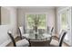 Bright dining area featuring a glass table and 6 cushioned chairs at 4808 Albany Way, Atlanta, GA 30331