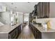 Modern kitchen with stainless steel appliances, granite countertops, and dark cabinetry at 4808 Albany Way, Atlanta, GA 30331