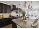 Eat-in kitchen with stainless steel appliances, granite countertops, and dark cabinetry at 4808 Albany Way, Atlanta, GA 30331