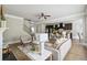 Open concept living area with view of the staircase and eat-in kitchen at 4808 Albany Way, Atlanta, GA 30331