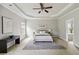 This main bedroom features neutral walls, carpeted floors, and an ensuite bathroom for ultimate comfort at 4808 Albany Way, Atlanta, GA 30331