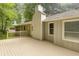 Enjoy the spacious wooden deck with chimney, perfect for outdoor gatherings and relaxation at 537 Raven Springs Trl, Stone Mountain, GA 30087