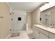 Modern bathroom featuring tiled shower with glass doors and stylish vanity at 537 Raven Springs Trl, Stone Mountain, GA 30087