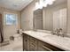 Elegant bathroom featuring double sinks, marble countertops, and a shower, creating a spa-like experience at 537 Raven Springs Trl, Stone Mountain, GA 30087