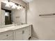 Bathroom featuring updated vanity, mirror, lighting and countertop at 537 Raven Springs Trl, Stone Mountain, GA 30087
