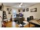 Cozy bedroom with hardwood floors, a ceiling fan, and a window, providing a comfortable and peaceful retreat at 537 Raven Springs Trl, Stone Mountain, GA 30087
