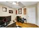 Functional bedroom with hardwood floors, a ceiling fan, and ample space, ideal for various activities at 537 Raven Springs Trl, Stone Mountain, GA 30087