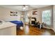 Inviting bedroom offers hardwood floors, two windows, and ample natural light, creating a warm and welcoming ambiance at 537 Raven Springs Trl, Stone Mountain, GA 30087