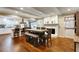 A dining area with an wooden table and chairs, with kitchen in the background, featuring a fireplace at 537 Raven Springs Trl, Stone Mountain, GA 30087