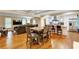 Dining room with an wooden table and chairs, flowing into living room with a modern kitchen at 537 Raven Springs Trl, Stone Mountain, GA 30087