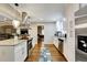 Modern kitchen features stainless steel appliances, granite countertops, and white cabinetry for a sleek and stylish design at 537 Raven Springs Trl, Stone Mountain, GA 30087
