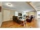 The living room with hardwood floors features comfortable seating and flows seamlessly into other living spaces at 537 Raven Springs Trl, Stone Mountain, GA 30087
