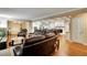 An open concept design features a living room and dining area with a modern kitchen and hardwood flooring at 537 Raven Springs Trl, Stone Mountain, GA 30087