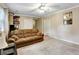 Comfortable living room featuring neutral walls, carpeting and a comfortable couch at 537 Raven Springs Trl, Stone Mountain, GA 30087