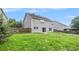Fenced backyard with sliding glass door at 926 Hawthorn Ln, Grayson, GA 30017