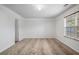 Well-lit bedroom featuring neutral carpeting and a large window for natural light at 926 Hawthorn Ln, Grayson, GA 30017