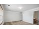 Carpeted bedroom featuring white trim, a single window and ensuite bathroom at 926 Hawthorn Ln, Grayson, GA 30017